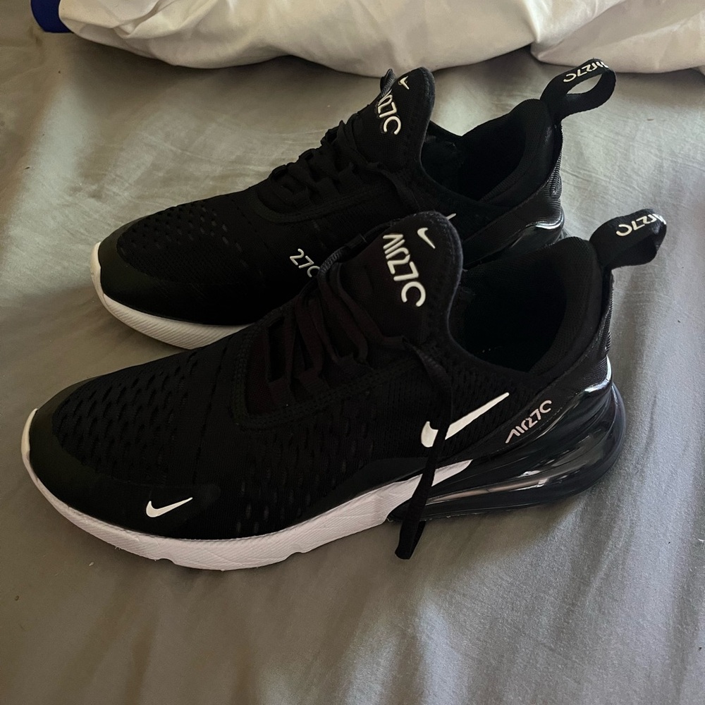 Black and white Nike air max 270 running shoes.
